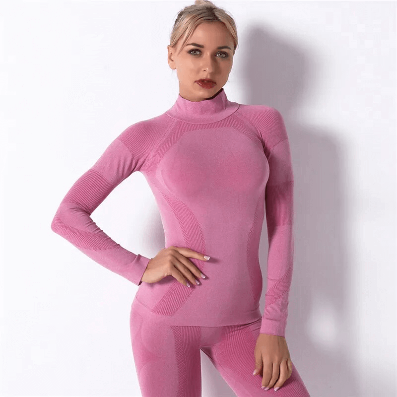 Stretchy seamless super soft pink long sleeves top for women, perfect for sports and yoga, made from breathable nylon fabric.